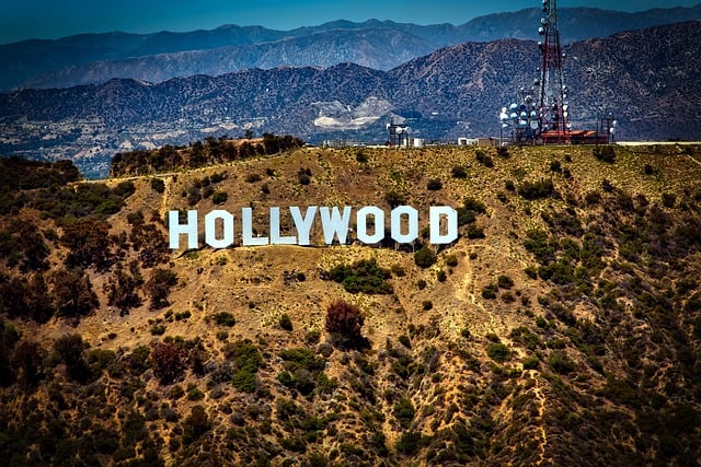 Hollywood sign on top of a hill.